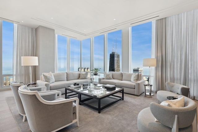 living room with a water view and floor to ceiling windows