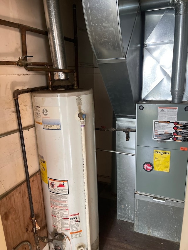 utility room featuring water heater