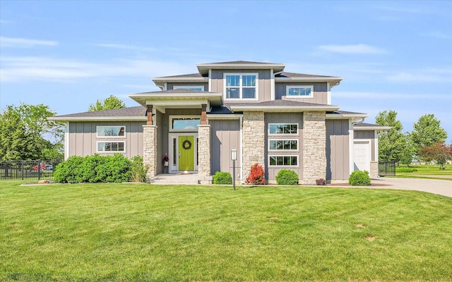 prairie-style house featuring a front lawn