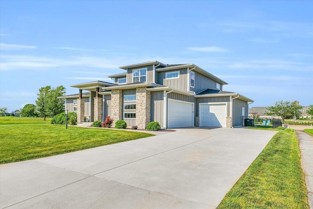 view of front of property with a garage and a front yard