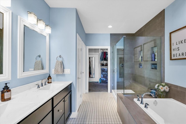 bathroom with vanity, independent shower and bath, and tile patterned flooring