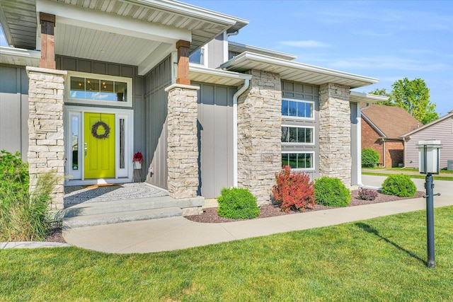 doorway to property featuring a yard