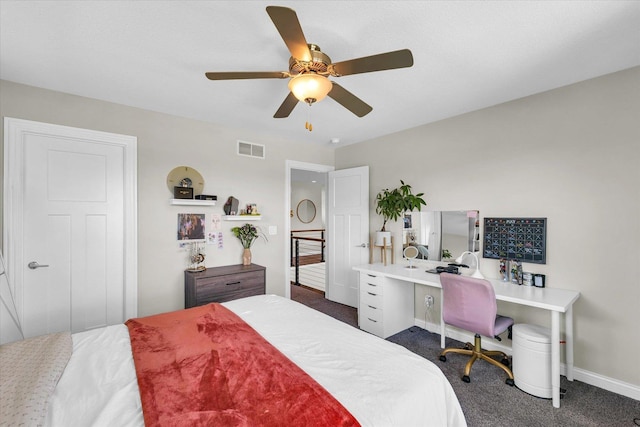 bedroom featuring ceiling fan and dark colored carpet