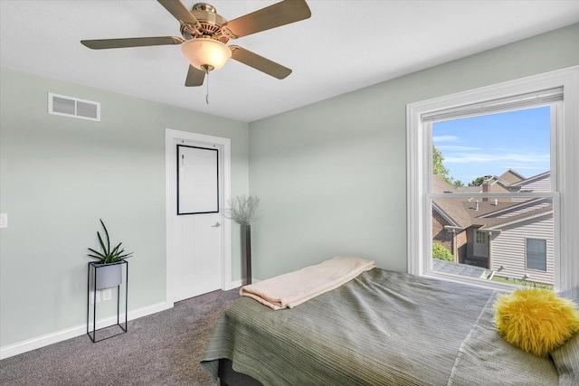 bedroom with dark carpet and ceiling fan