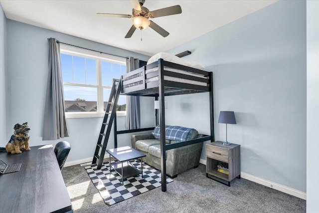 bedroom featuring ceiling fan and dark carpet