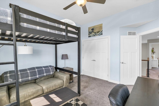 bedroom with ceiling fan and carpet flooring