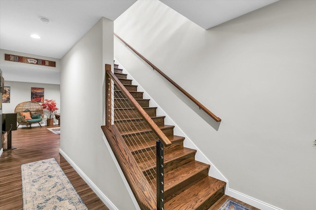 staircase featuring hardwood / wood-style floors