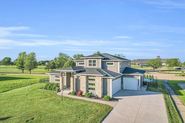 view of front facade featuring a garage and a front lawn