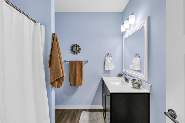 bathroom with vanity and hardwood / wood-style floors