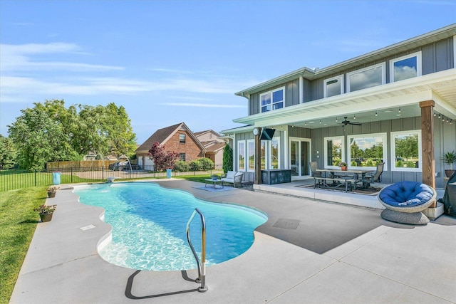 view of pool featuring pool water feature, ceiling fan, outdoor lounge area, and a patio