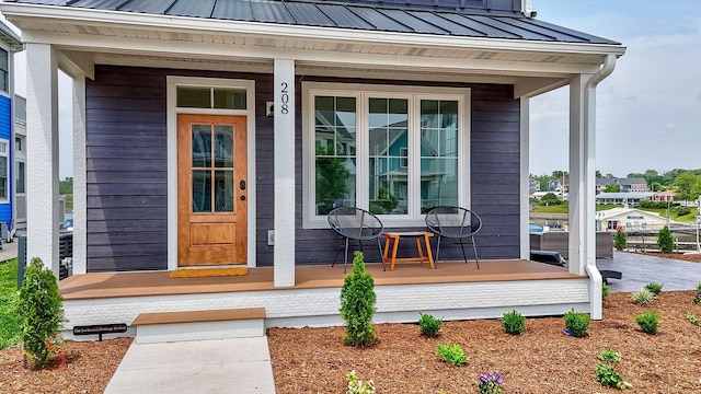 208 Leeward Way, Ottawa, IL 61350 - entrance to property with a porch, a metal roof, and a standing seam roof
