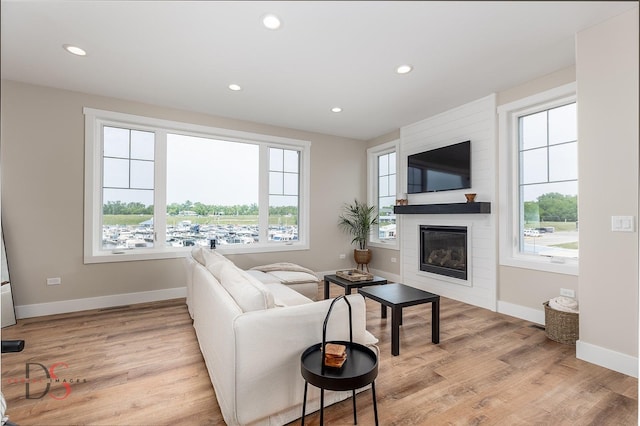 208 Leeward Way, Ottawa, IL 61350 - living room featuring a large fireplace, plenty of natural light, recessed lighting, and light wood-style floors