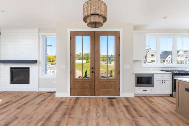 foyer entrance with french doors and plenty of natural light