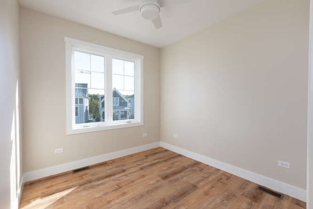 unfurnished room featuring hardwood / wood-style flooring and ceiling fan