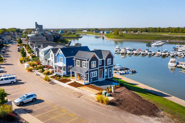 birds eye view of property featuring a water view