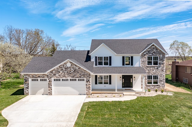 view of front of property with a garage and a front lawn