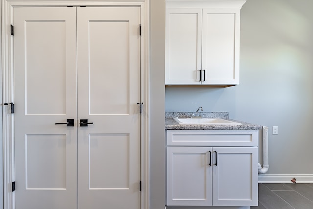 interior space with tile patterned floors and sink