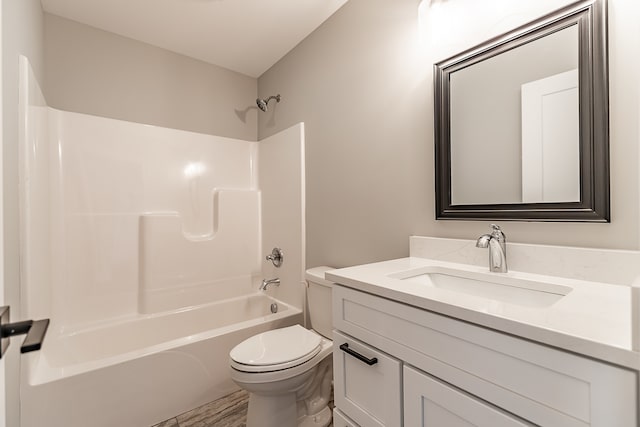 full bathroom featuring vanity, bathtub / shower combination, and toilet