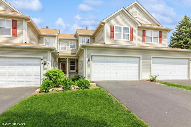211 Grand Ridge Rd, Saint Charles, IL 60175 - view of front facade with driveway, a garage, and a front lawn