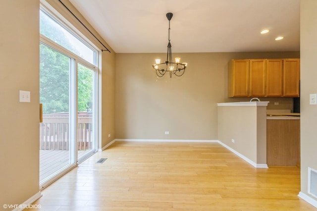211 Grand Ridge Rd, Saint Charles, IL 60175 - unfurnished dining area featuring a chandelier, light wood-style flooring, recessed lighting, and baseboards