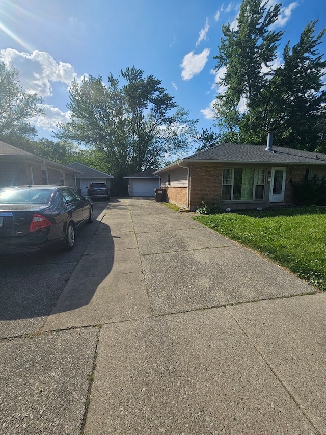 view of side of home featuring a garage and a yard