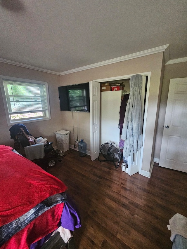 bedroom with ornamental molding, dark hardwood / wood-style floors, and a textured ceiling