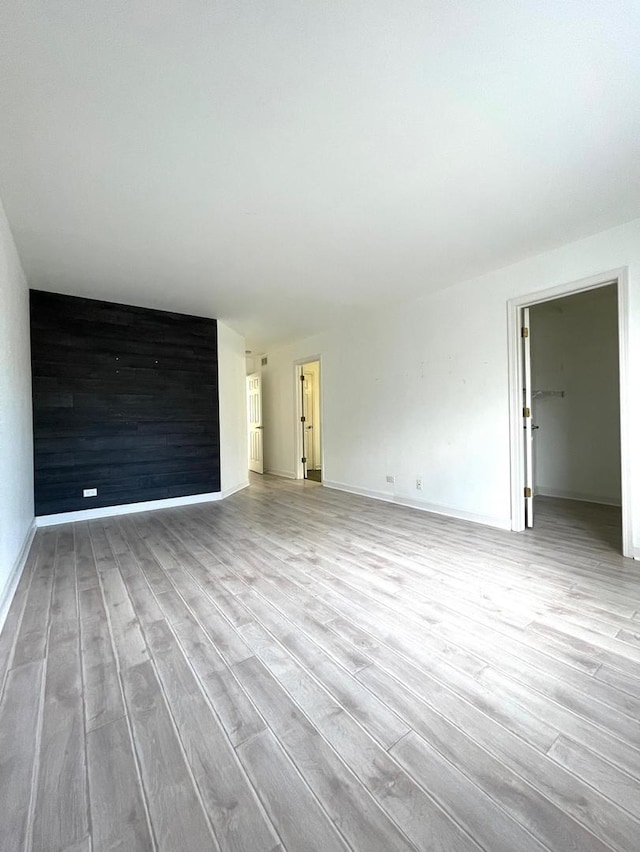 unfurnished living room featuring light hardwood / wood-style floors