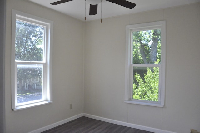 unfurnished room featuring dark hardwood / wood-style floors and ceiling fan