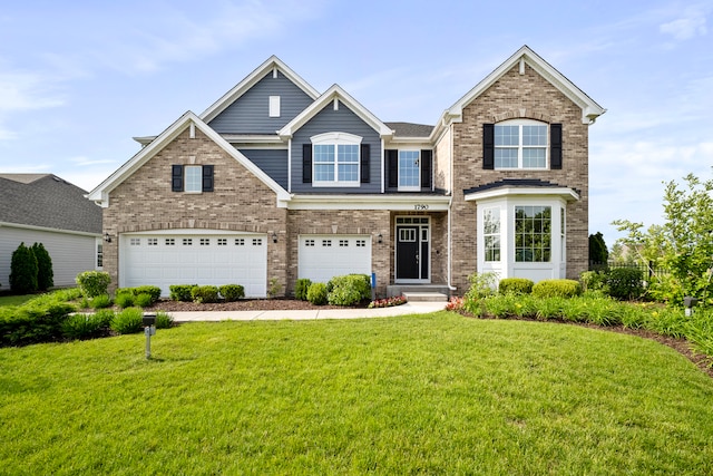 view of front of house featuring a garage and a front yard