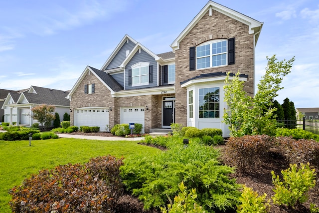 craftsman-style house with a front lawn and a garage