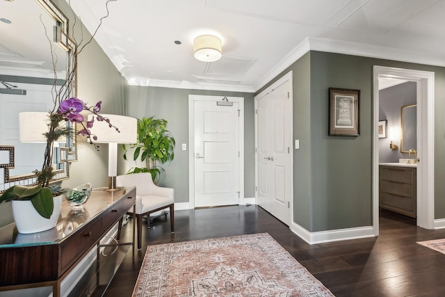 entrance foyer featuring ornamental molding and dark wood-type flooring