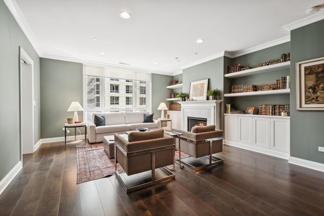 living room with ornamental molding, built in features, and dark wood-type flooring