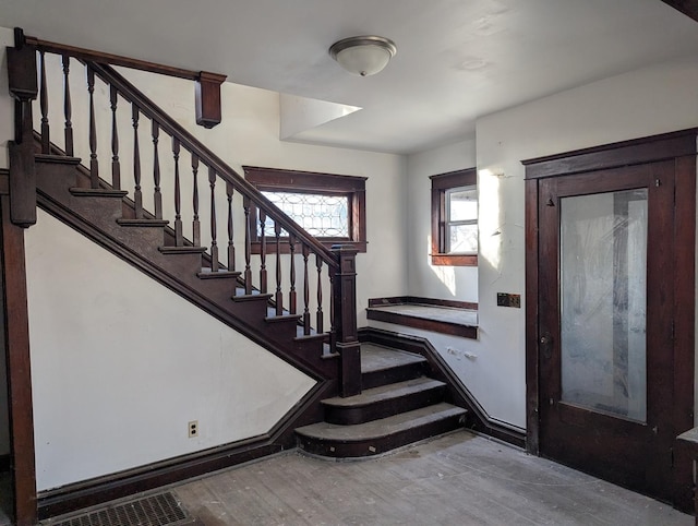 staircase with wood-type flooring