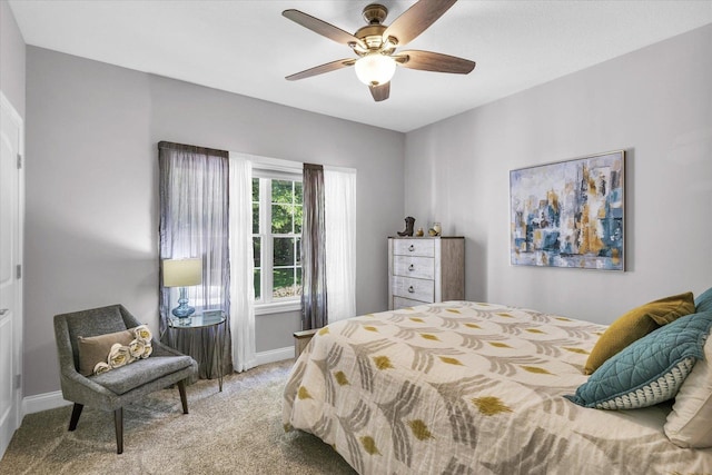 bedroom with baseboards, a ceiling fan, and light colored carpet