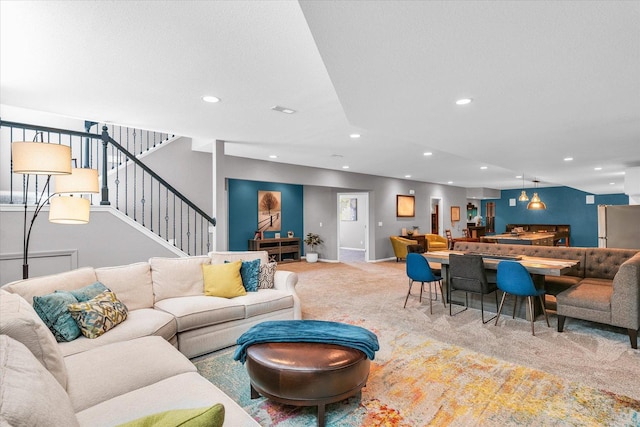 living area with recessed lighting, carpet flooring, baseboards, and stairs