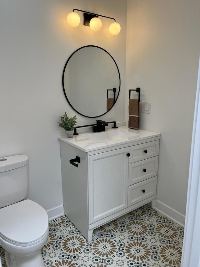 bathroom with tile flooring, oversized vanity, and toilet