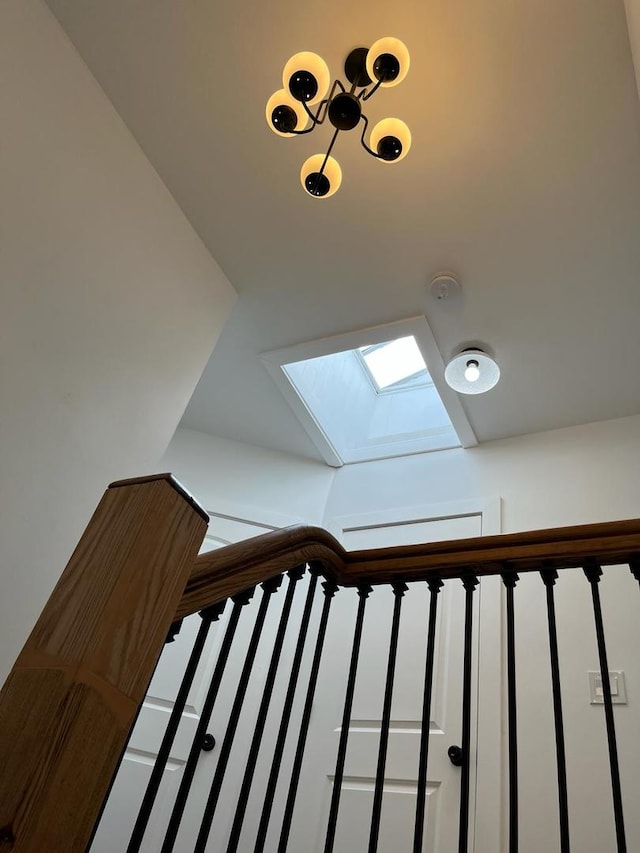 staircase featuring a skylight