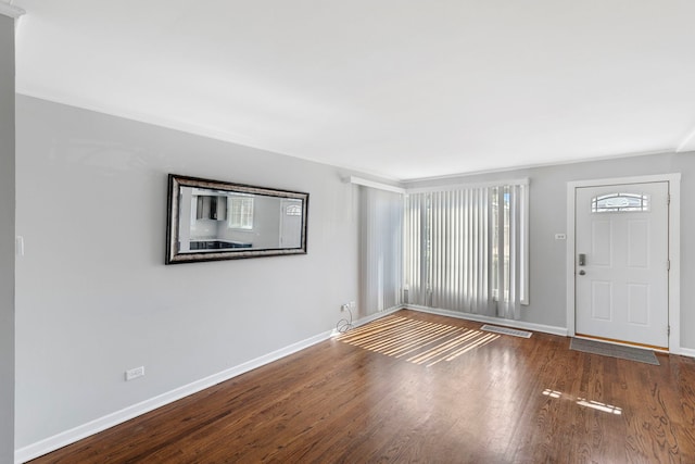 foyer entrance with dark wood-type flooring