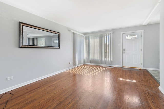 foyer with dark hardwood / wood-style floors