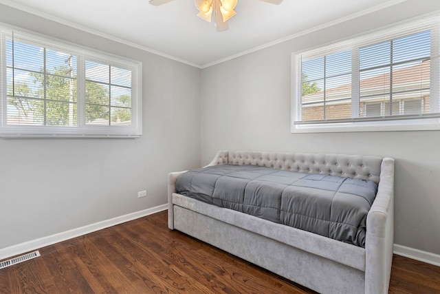 bedroom with dark wood-type flooring, ceiling fan, and multiple windows