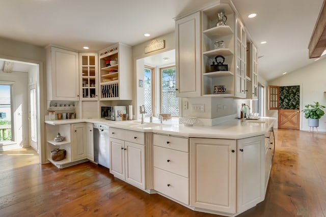 kitchen with white cabinets, appliances with stainless steel finishes, and a healthy amount of sunlight