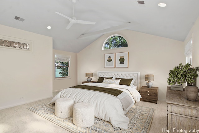 carpeted bedroom with vaulted ceiling and ceiling fan