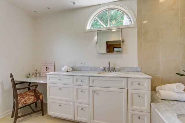 bathroom featuring tile patterned flooring and vanity