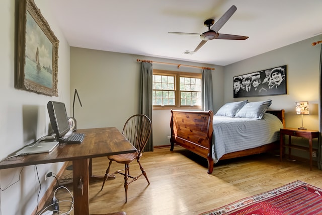 bedroom with ceiling fan and light hardwood / wood-style flooring