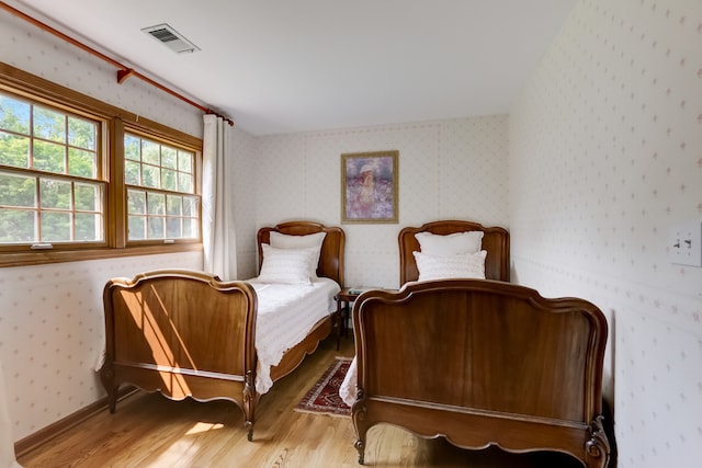 bedroom featuring wood-type flooring