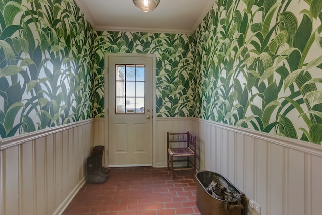 doorway featuring crown molding