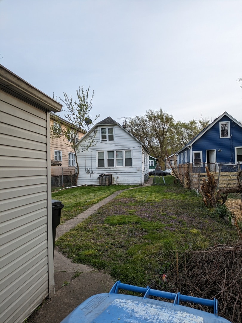 back of house with a yard