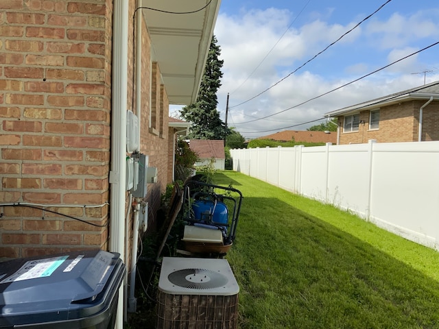 view of yard with central AC