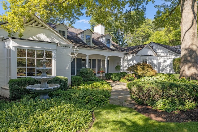 rear view of property with a chimney