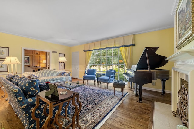 living room with crown molding and hardwood / wood-style flooring